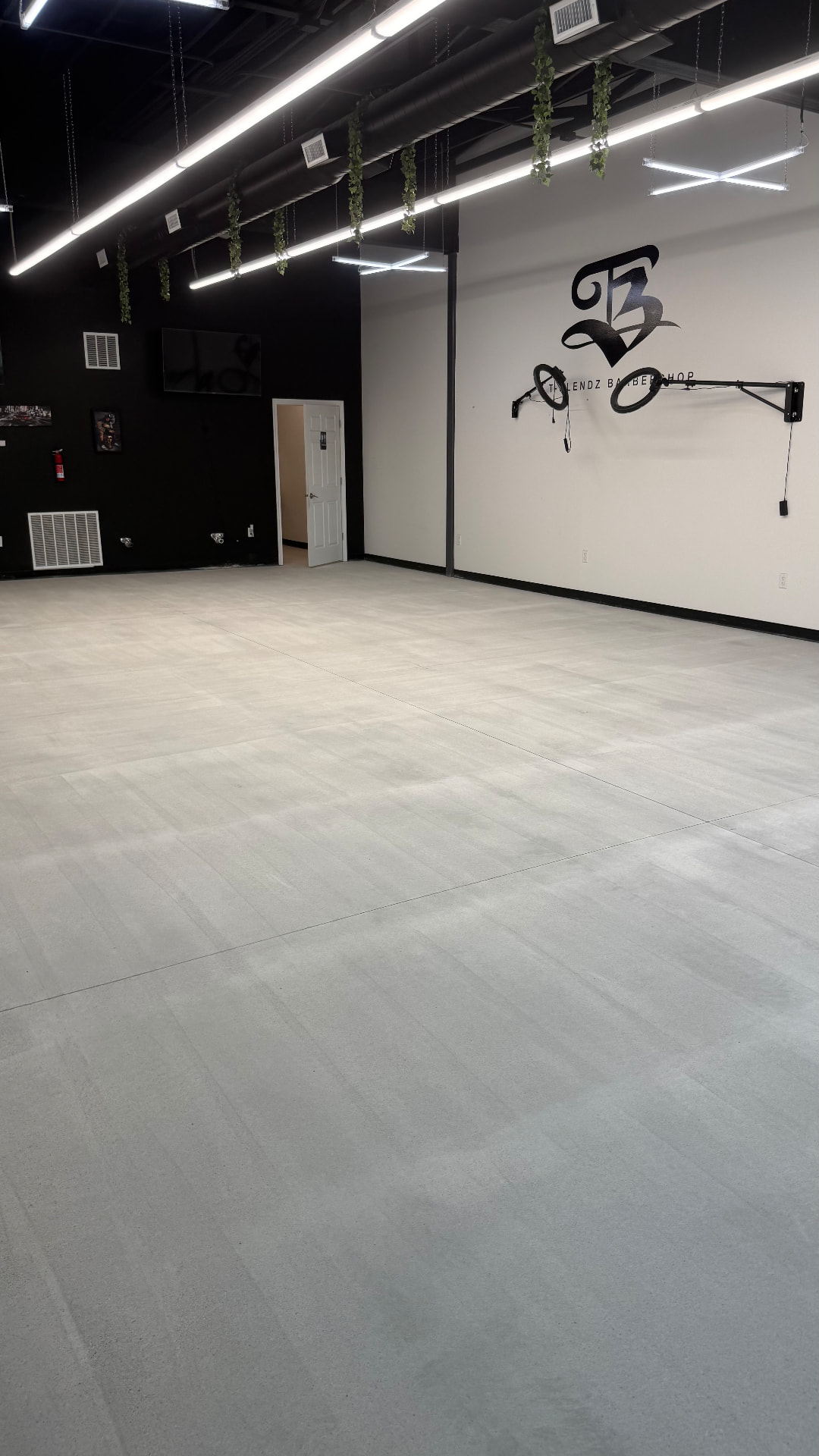Before: Bare concrete commercial floor before the epoxy coating was installed