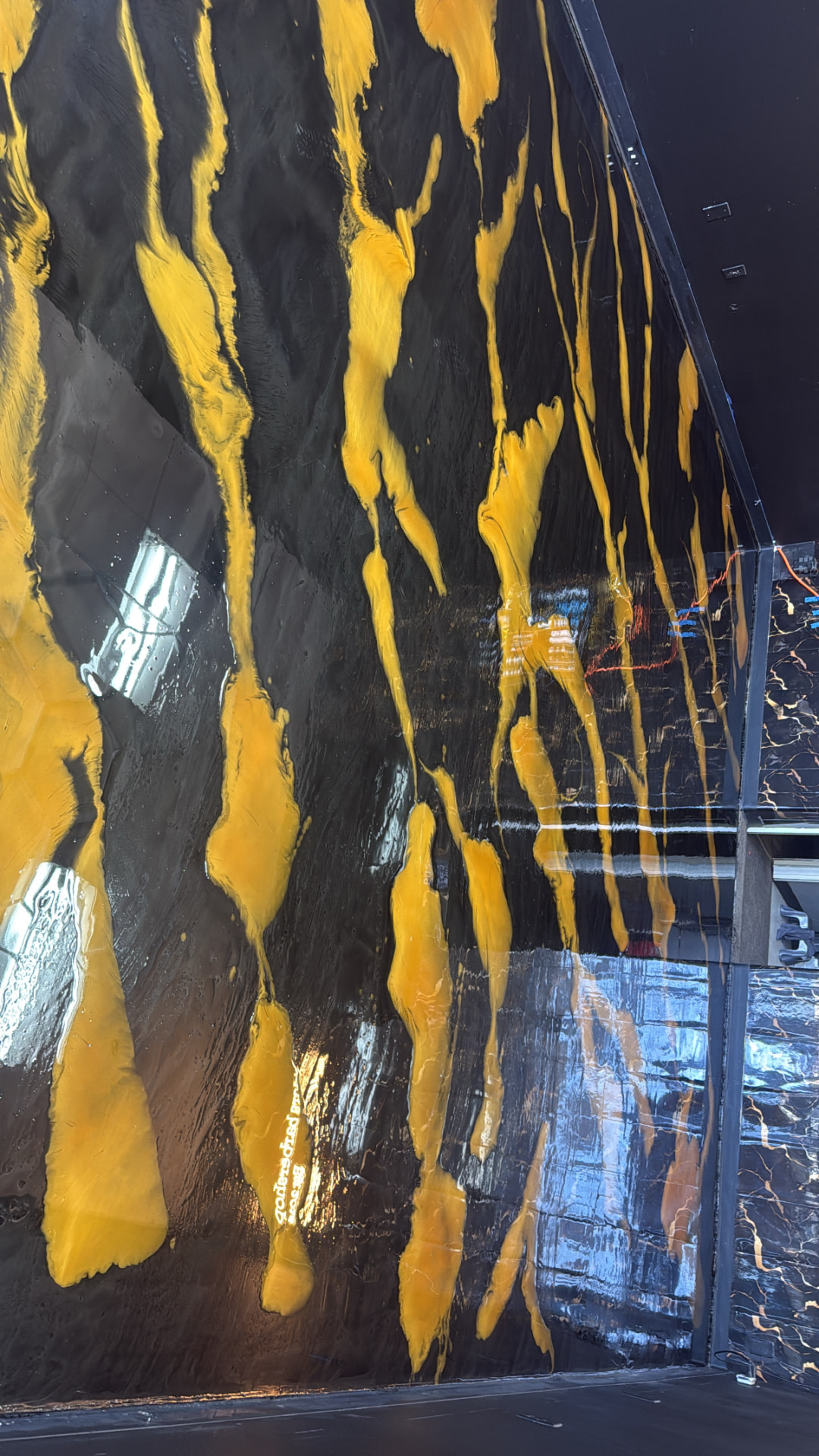 Black and gold marbled metallic epoxy surface with deep gloss