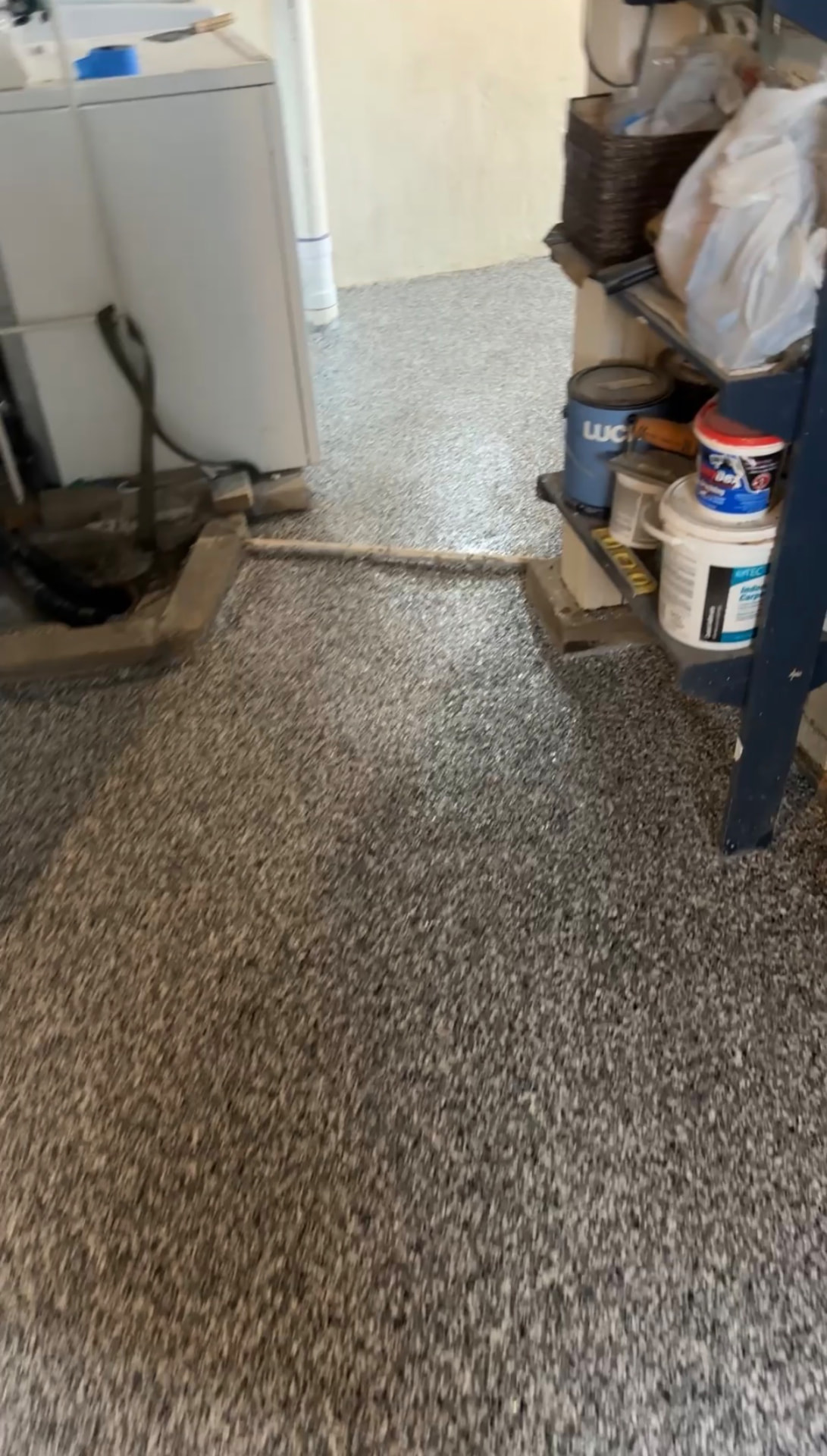 Gray Flake Garage & Storage Floor — Gray flake floor coating continued through a garage utility area